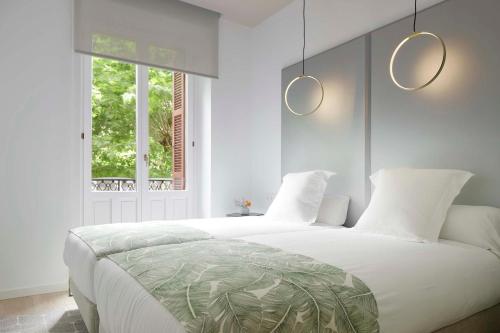 Posteľ alebo postele v izbe v ubytovaní Avenida Suite by FeelFree Rentals