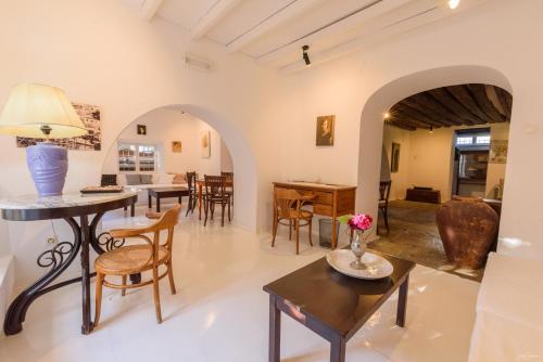 a living room with a table and chairs at Hotel Miranda in Hydra