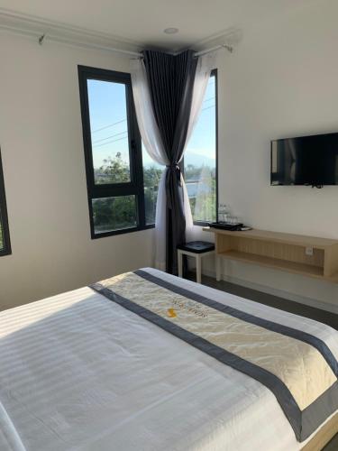 Postel nebo postele na pokoji v ubytování Summering Hotel