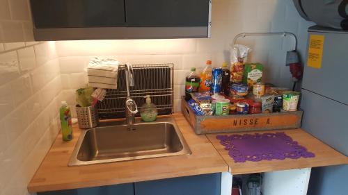a kitchen counter top with a sink and a counter top at Sollyckan in Knivsta