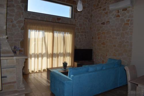 Телевизор и/или развлекательный центр в Villa Tramonto Keri