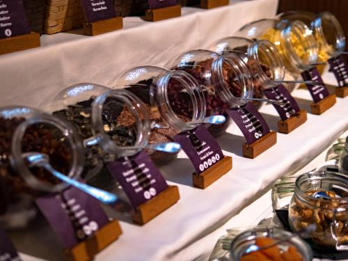 a row of wine tasting trophies on display at Hotel Evropa in Celje
