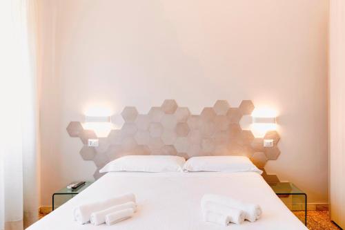 Postel nebo postele na pokoji v ubytování Roma Talenti Fucini B&B