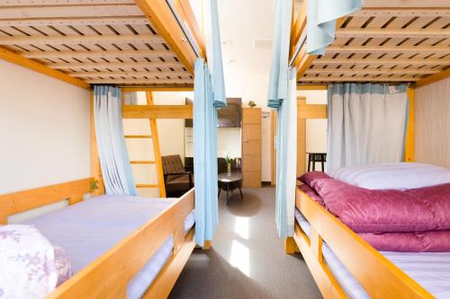 מיטה או מיטות קומותיים בחדר ב-ABC Guesthouse (1F)