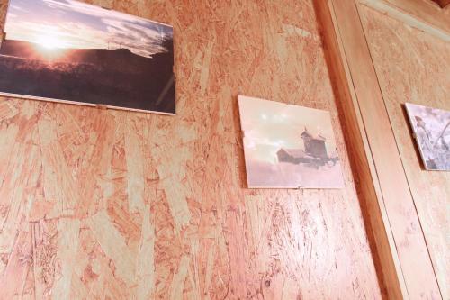 three pictures hanging on a wall in a room at Casa Viade in Montalegre