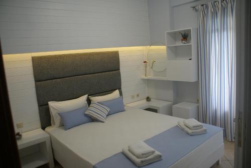 Cama o camas de una habitación en Nostos Rooms Ammouliani