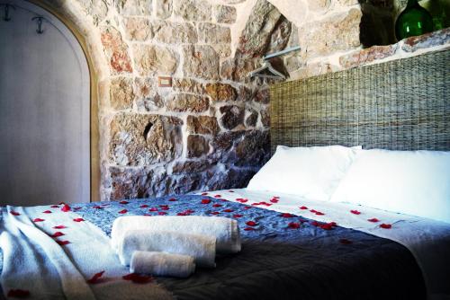 En eller flere senge i et værelse på Dimore Storiche - Ulivo di Aldo