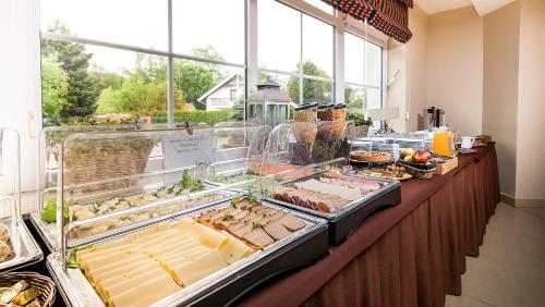 a buffet line with many different types of food at Willa Kłodzko - Zacisze in Kłodzko