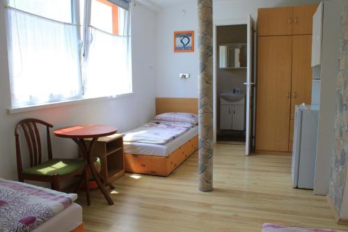 Postel nebo postele na pokoji v ubytování Touring & Sport Hotel Siófok