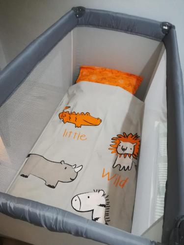 a white box with different animals on it at Apartment Elena in Sumartin