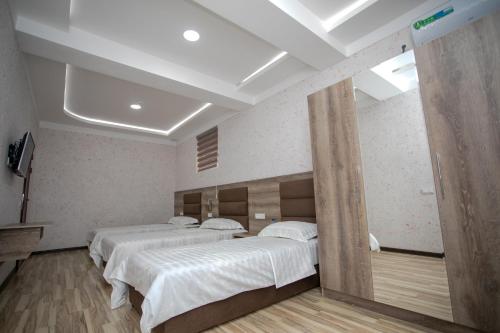 Ένα ή περισσότερα κρεβάτια σε δωμάτιο στο Niso