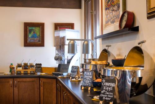 a kitchen with a counter with some food on it at The Sage Hotel in Santa Fe