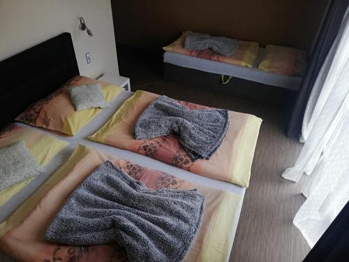 Postel nebo postele na pokoji v ubytování Penzion Andy