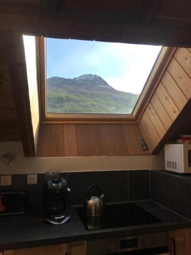 Dapur atau dapur kecil di Appartement Duplex avec Jardin Attenant