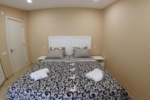 Ένα ή περισσότερα κρεβάτια σε δωμάτιο στο VIP Sweet Home in Shekvetili