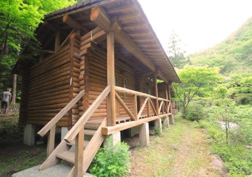 a wooden cabin in the middle of a forest at Nature Resort in Shimanto / Vacation STAY 33201 in Funato