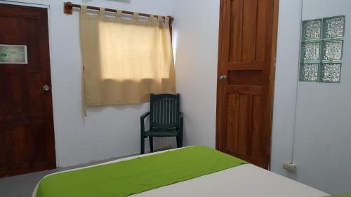 Postel nebo postele na pokoji v ubytování Hotel La Jungla