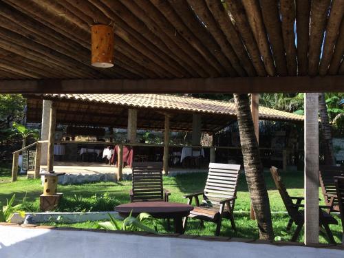 a group of chairs and a table under a pavilion at WegoKite Stars in Taíba