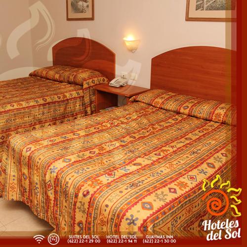Una cama o camas en una habitación de Hotel Del Sol
