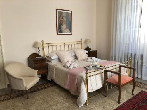 מיטה או מיטות בחדר ב-Casa Gabriella