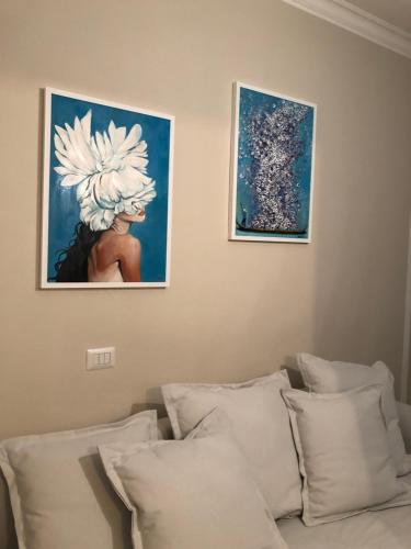A bed or beds in a room at Vivi Cernobbio, la sua arte, la sua magia
