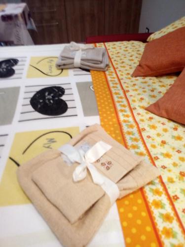 a table topped with a table cloth with a table sidx sidx at Case Vacanza Le Casette in Santo Stefano di Camastra