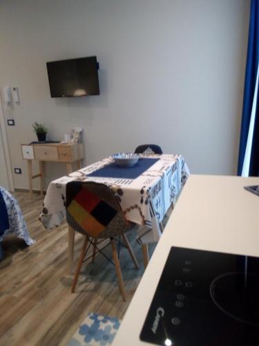 a room with a table with a table cloth on it at Case Vacanza Le Casette in Santo Stefano di Camastra
