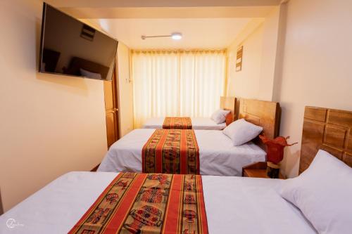 Ένα ή περισσότερα κρεβάτια σε δωμάτιο στο Quechua Hostal Recoleta