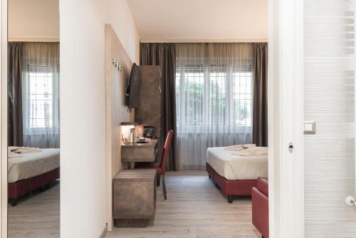 Postel nebo postele na pokoji v ubytování Le Nove Muse Guesthouse