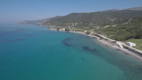 an aerial view of a beach and the ocean at Dora's House in Ístrios