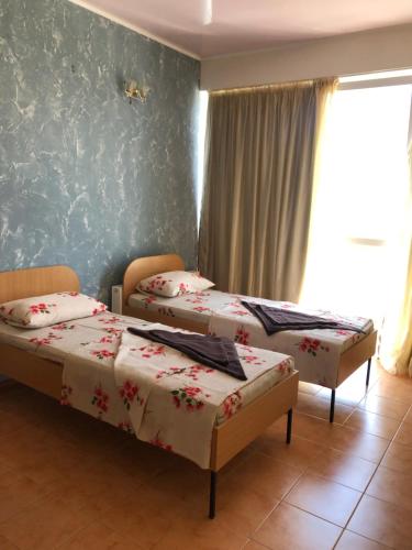 En eller flere senge i et værelse på Морская жемчужина