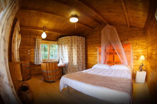 Postel nebo postele na pokoji v ubytování Ecolodge Langhe