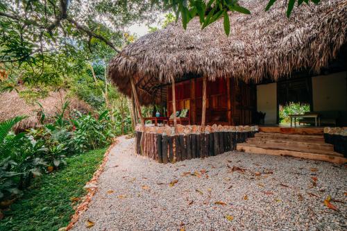 a small hut with a straw roof at El Valle Lodge in El Valle