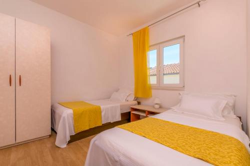Posteľ alebo postele v izbe v ubytovaní Apartments Vincic