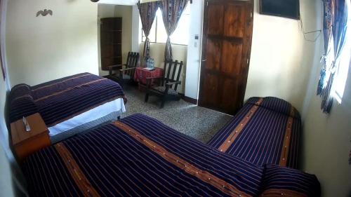 Ένα ή περισσότερα κρεβάτια σε δωμάτιο στο Hotel Sueño Real