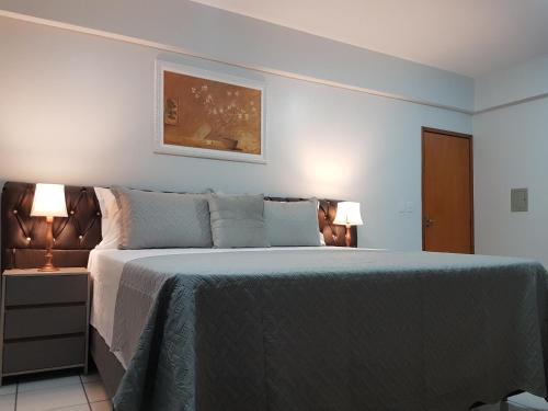 Ένα ή περισσότερα κρεβάτια σε δωμάτιο στο B & A Suites Inn Hotel - Quarto Luxo Diamond