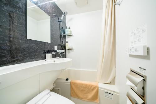 Ένα μπάνιο στο IKIDANE Residential Hotel Komagome