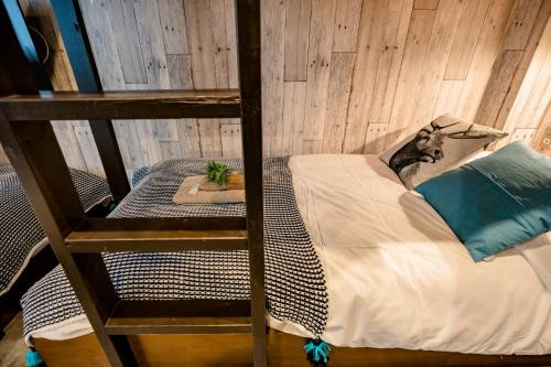 Ένα ή περισσότερα κρεβάτια σε δωμάτιο στο IKIDANE Residential Hotel Komagome