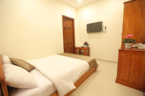 TV a/nebo společenská místnost v ubytování Hotel Phạm Duy