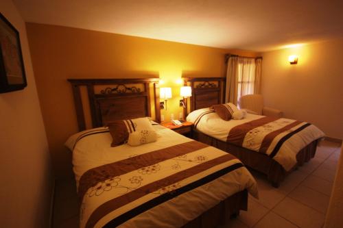 Katil atau katil-katil dalam bilik di Hotel San Jose
