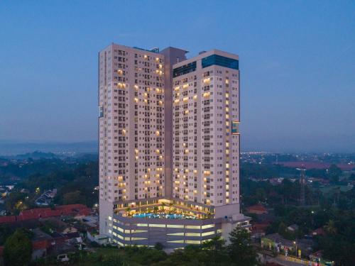 a tall white building with lights on it at Sahid Serpong in Serpong