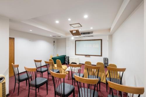 a conference room with a table and chairs at JL Bangkok Hotel in Bangkok