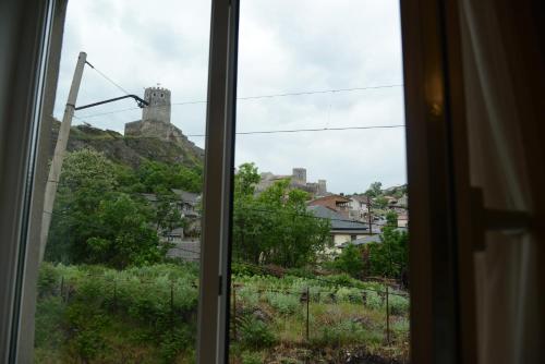 a view of a castle from a window at Hotel Like in Akhaltsikhe