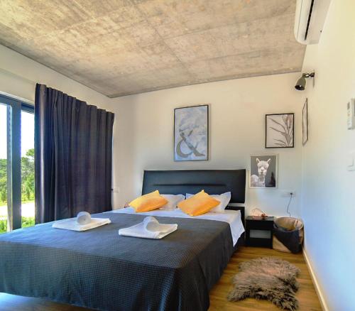 Ένα ή περισσότερα κρεβάτια σε δωμάτιο στο Villa Pietra