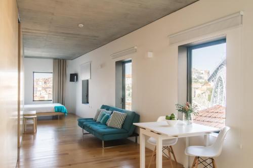 a living room with a couch and a table at Oh! Porto Apartments in Vila Nova de Gaia