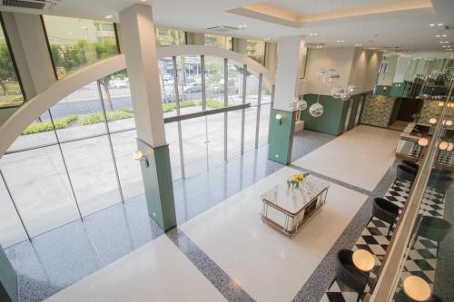 an overhead view of a fashion store with a lobby at Justice Hotel in Bangkok
