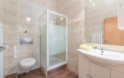 a bathroom with a shower and a toilet and a sink at Maja Apartment 3 in Funtana