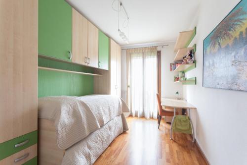 Ένα ή περισσότερα κρεβάτια σε δωμάτιο στο Sunrise Apartment Venice