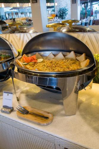 a large pan of food on display in a store at Sur Beach Resort Boracay in Boracay