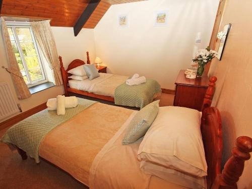 Postel nebo postele na pokoji v ubytování Nanparra Cottage